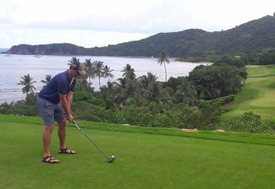 Spence golfing in a tropical place