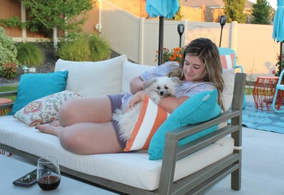 Employee Tayler relaxing with her dog Chief