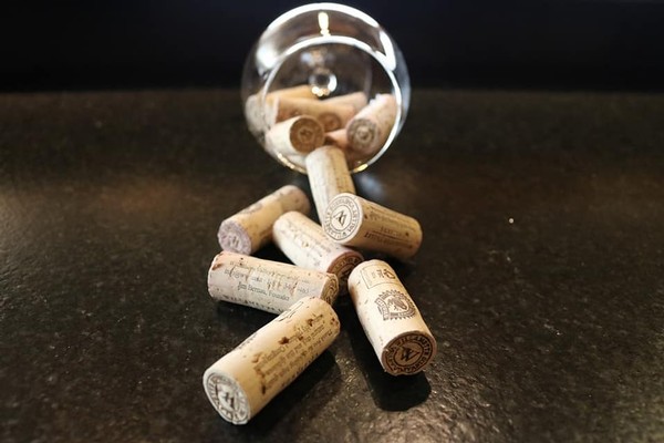 Natural corks in wine glass