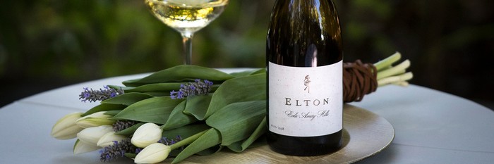 Bottle of Elton Chardonnay with bouquet of tulips
