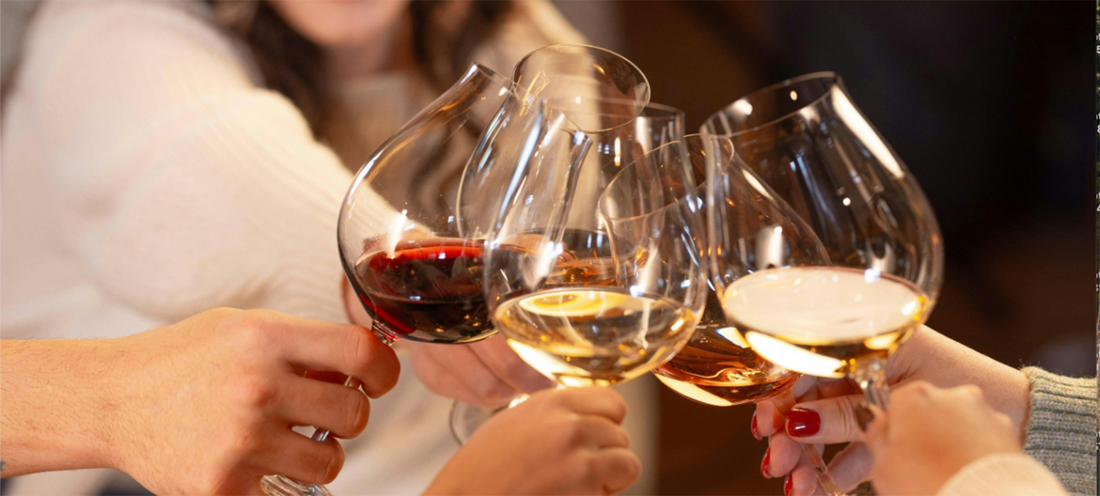 Wine glasses together over a table