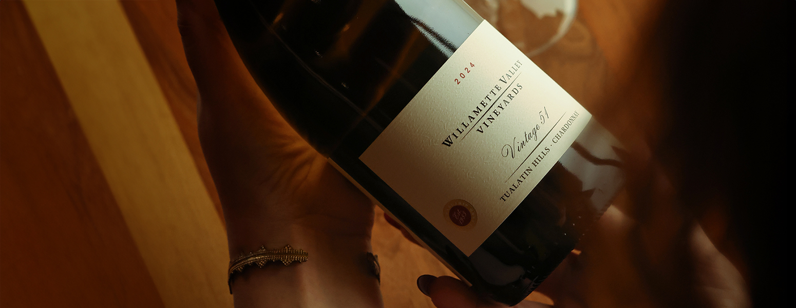 place setting with forks and knifes, menu and wine glasses