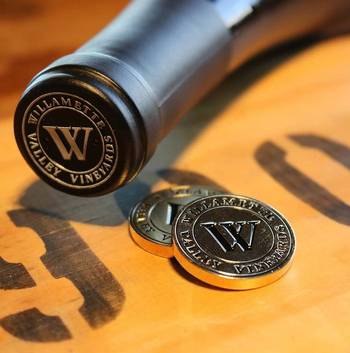 Gold coin and Willamette wine bottle