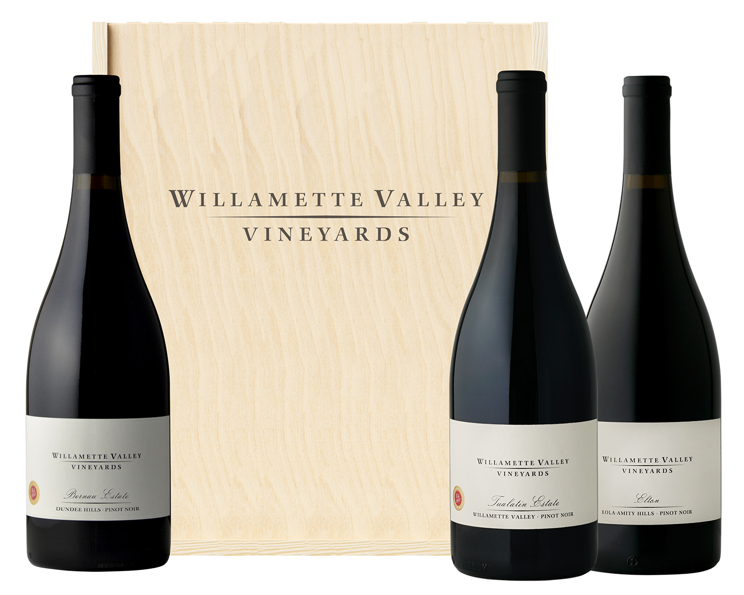 Three Willamette Valley Vineyards wine bottles inside a wooden box surrounded by holly