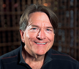 Headshot of Founder Jim Bernau smiling