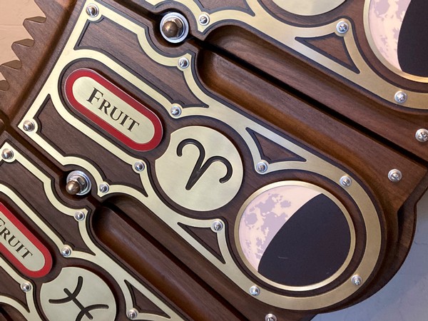 The large dial contains the tiles with the moon's position, zodiac signs and diagrams that instruct guests on what stage of farming the vineyard is at based on the day.