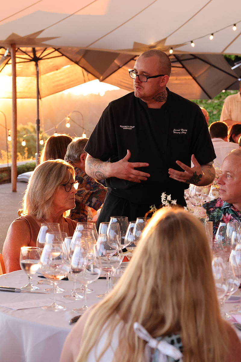 Chef Jarred Henry speaking with Owners at their annual pairings dinner at the Estate in the Salem Hills.